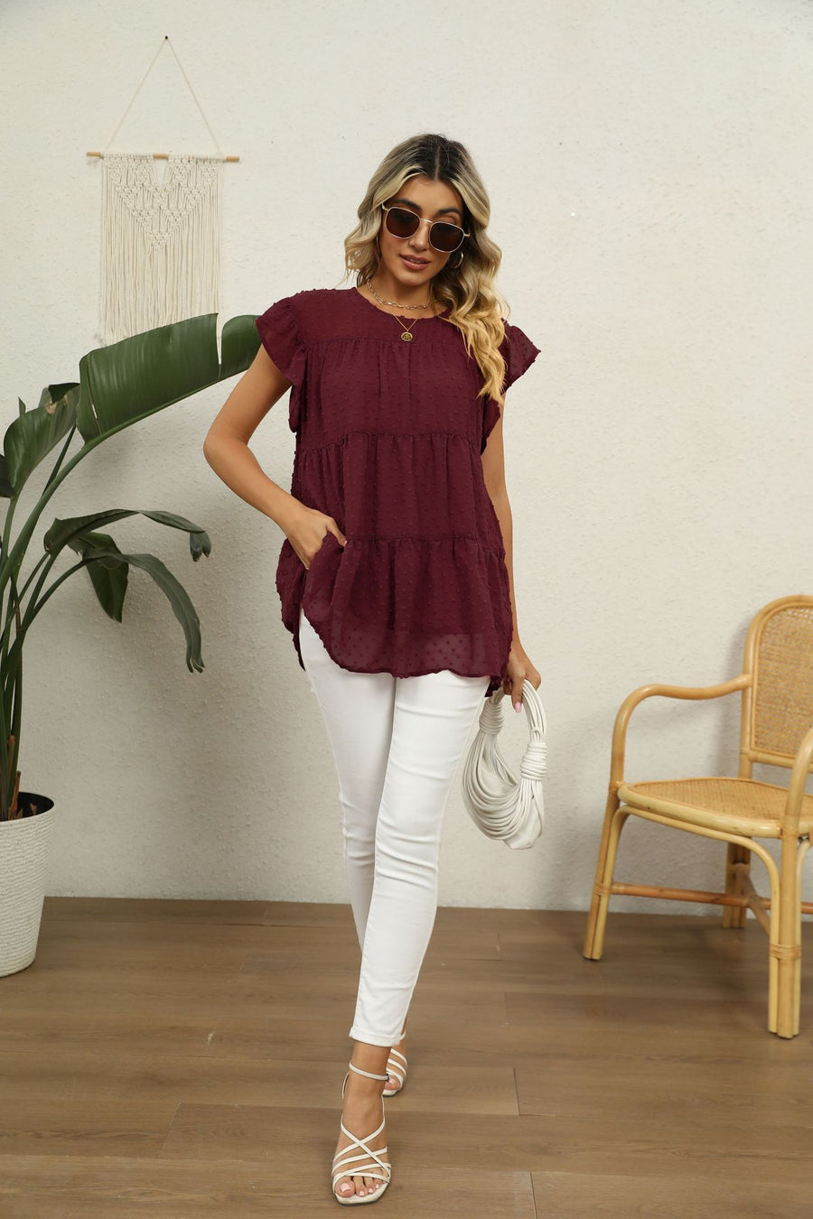 Swiss dot flutter sleeve blouse in Brick Red with tiered ruffle hem and pockets.