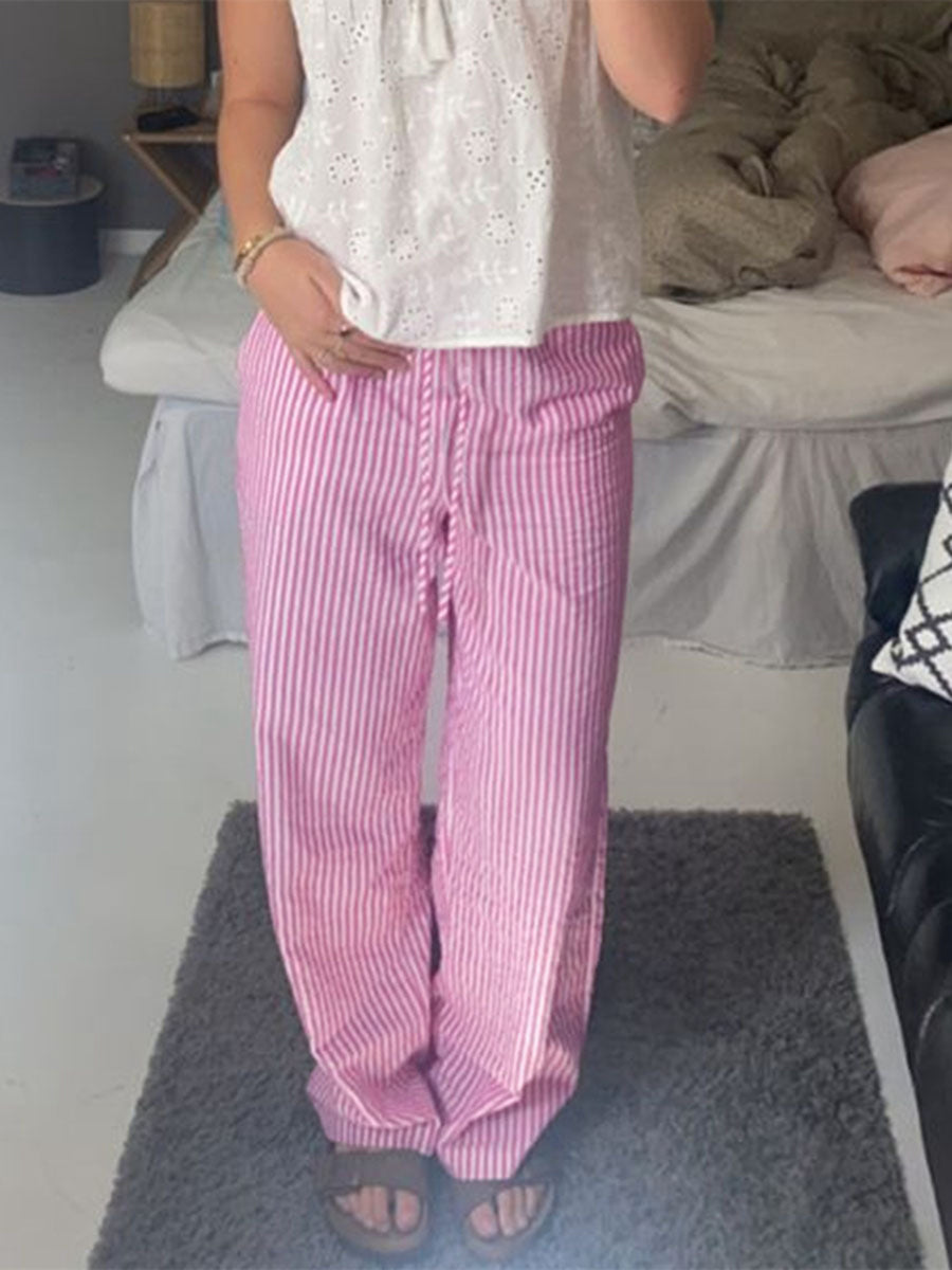 100% polyester Care instructions: Machine wash cold wide-leg pants in Pink with loose silhouette
