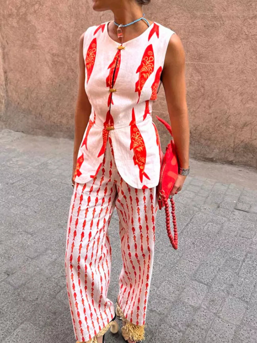 Red fish print two-piece set with button detail on sleeveless top and wide-leg pants.
