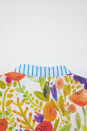 Cotton mini dress with vibrant floral print and blue striped collar detail.