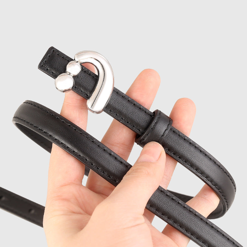 Black skinny leather belt with a silver buckle