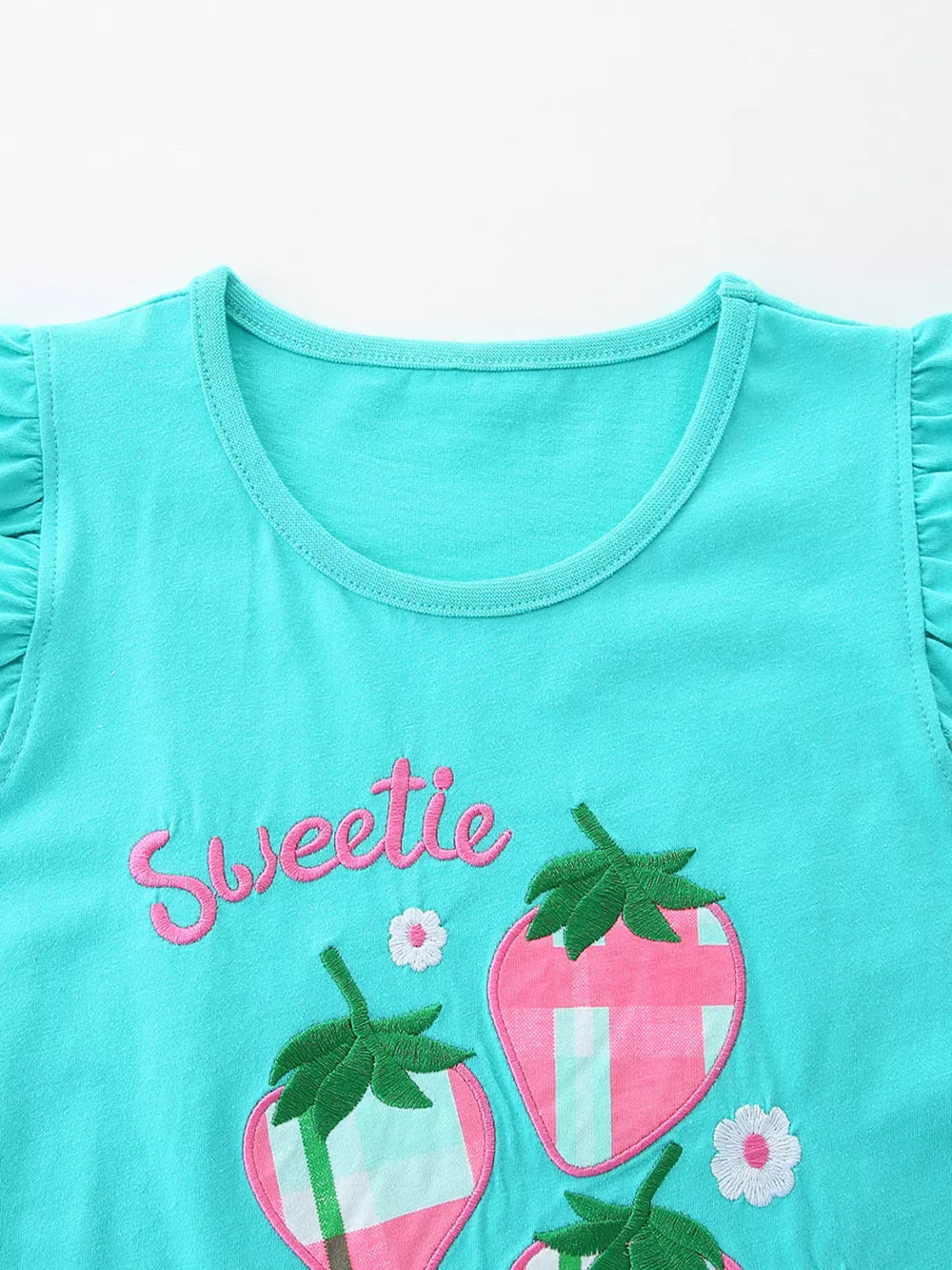 Toddler girls' turquoise cotton blend set with strawberry embroidery and ruffle sleeves.