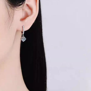earrings in silver featuring moissanite stones and drop fit
