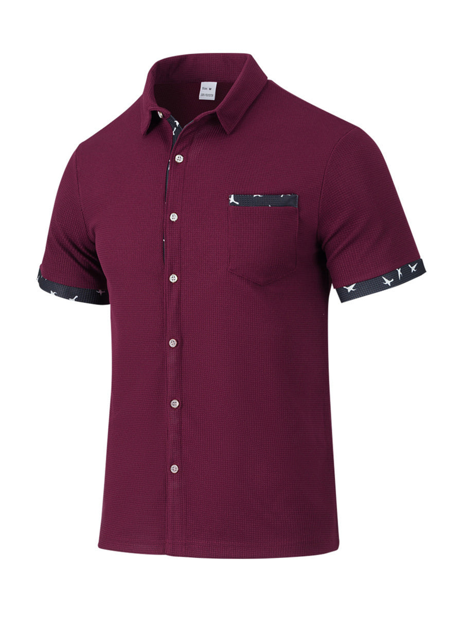 Burgundy waffle textured button-up shirt with bird print accents on pocket and sleeves.