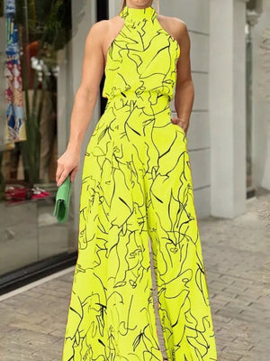 Canary yellow abstract print halter neck wide leg romper with pockets