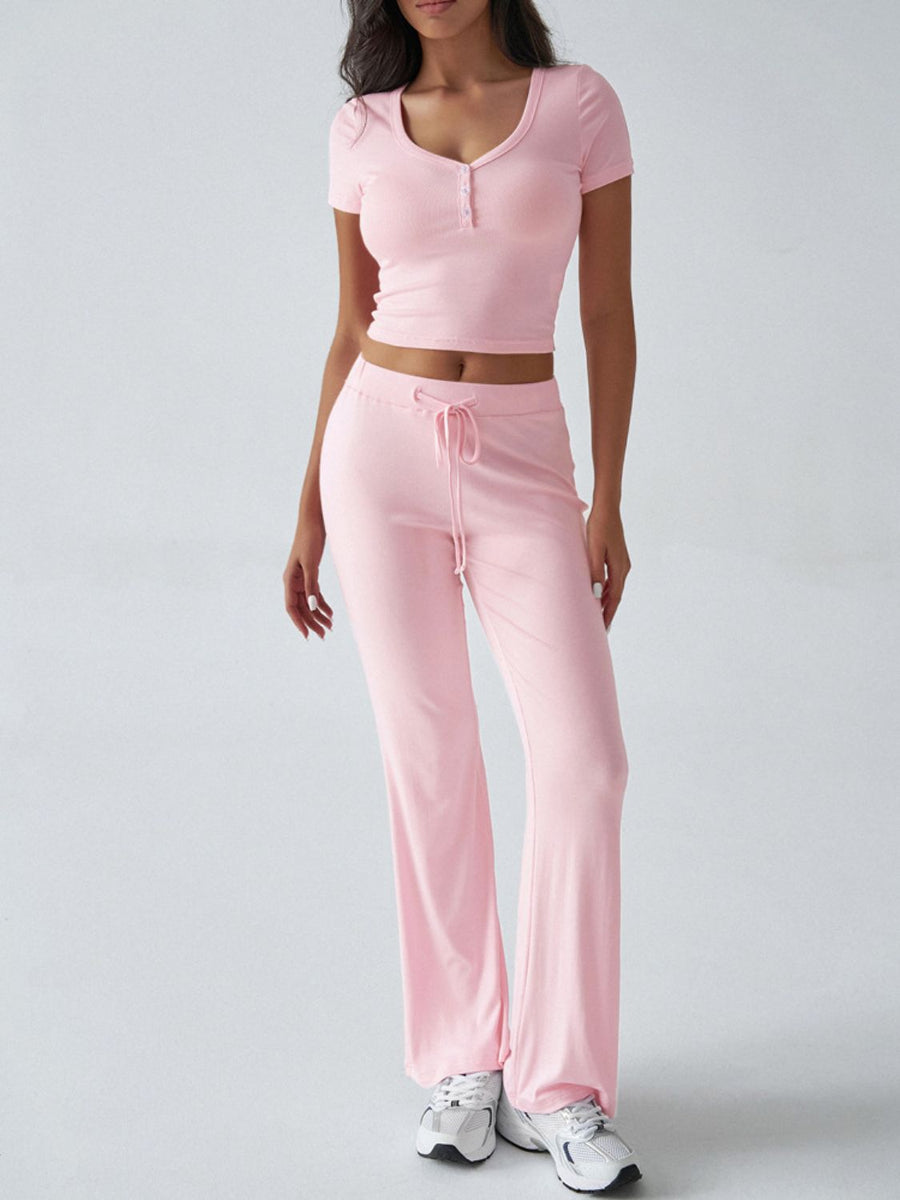 Blush pink button-front crop top and flared lounge pants set with drawstring waist.