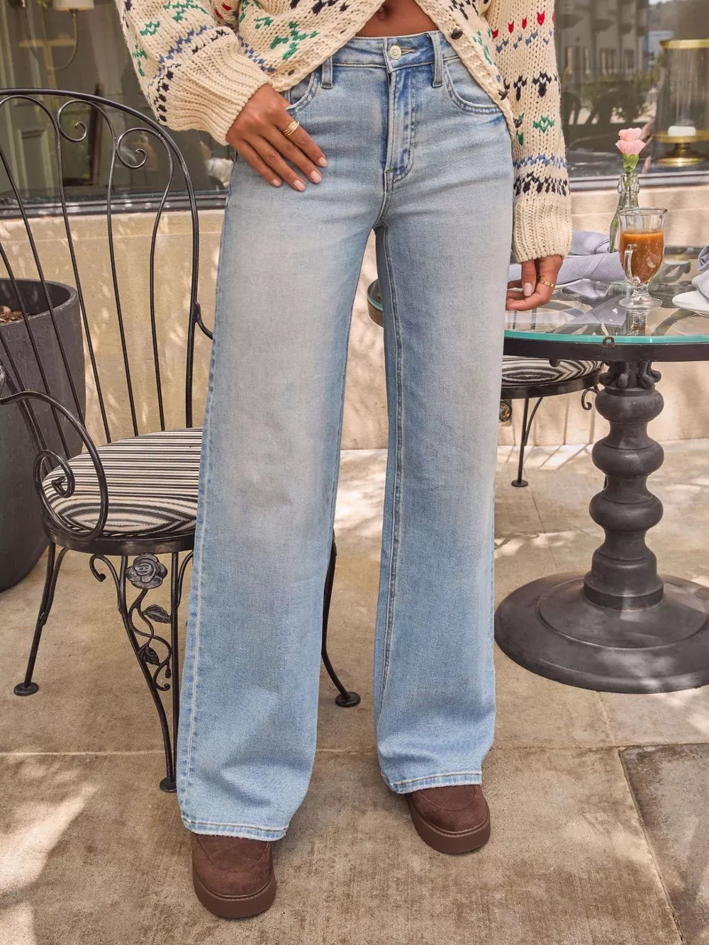 Light blue denim wide-leg jeans with a high waist and buttoned fly.