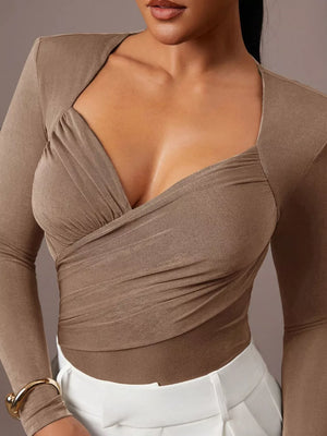 burgundy bodysuit with stretch and long sleeve