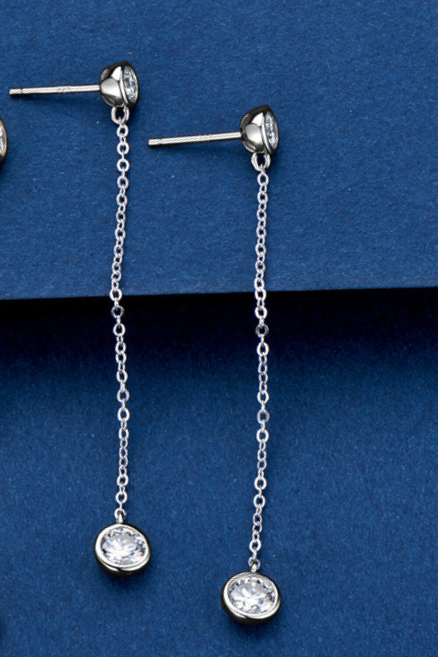 Silver chain drop earrings with a bezel-set crystal charm