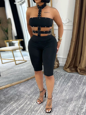 romper in black featuring cutout and fitted fit