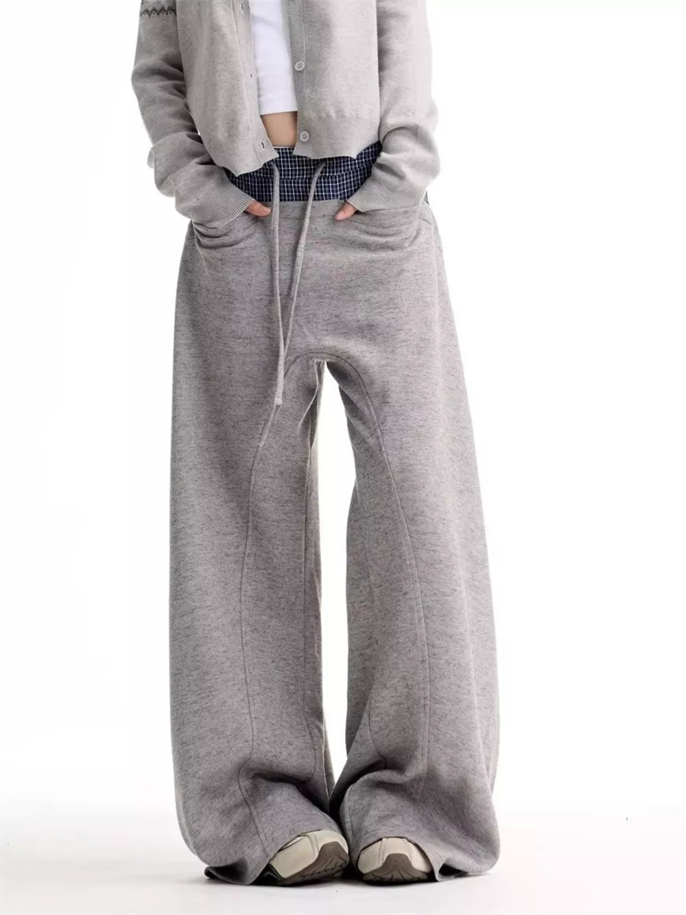 Grey wide-leg sweatpants with drawstring waist and pockets.