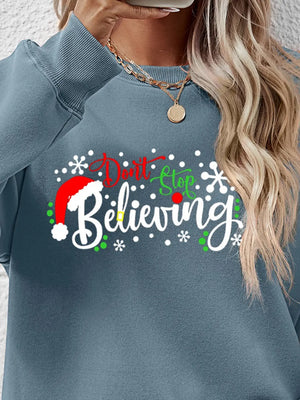 Air Force Blue long sleeve sweater with "Don't Stop Believing" graphic and Santa hat detail.