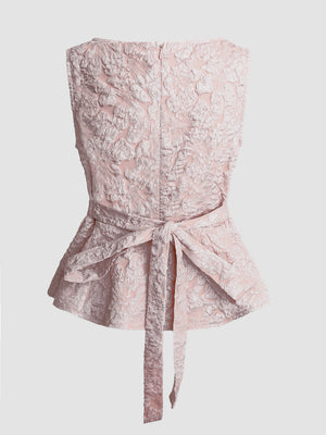 Textured floral peplum tank top in dusty pink with a tie waist and boat neckline.