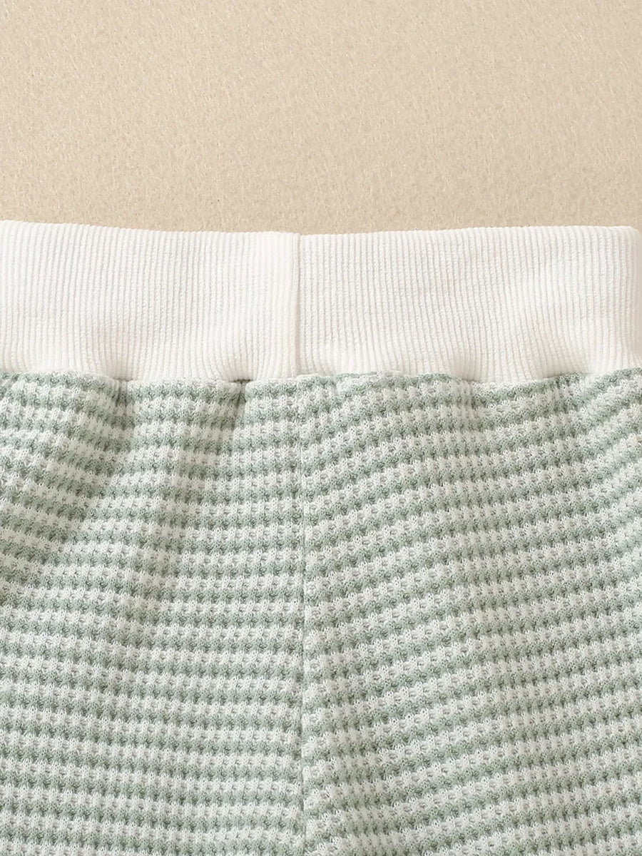 Light green striped baby set with waffle knit fabric and white ribbed waistband.