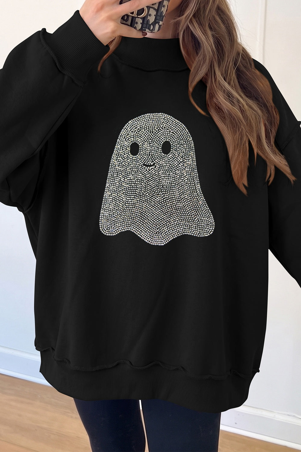 65% polyester, 35% cotton Care instructions: Machine wash cold sweatshirt in black with relaxed silhouette