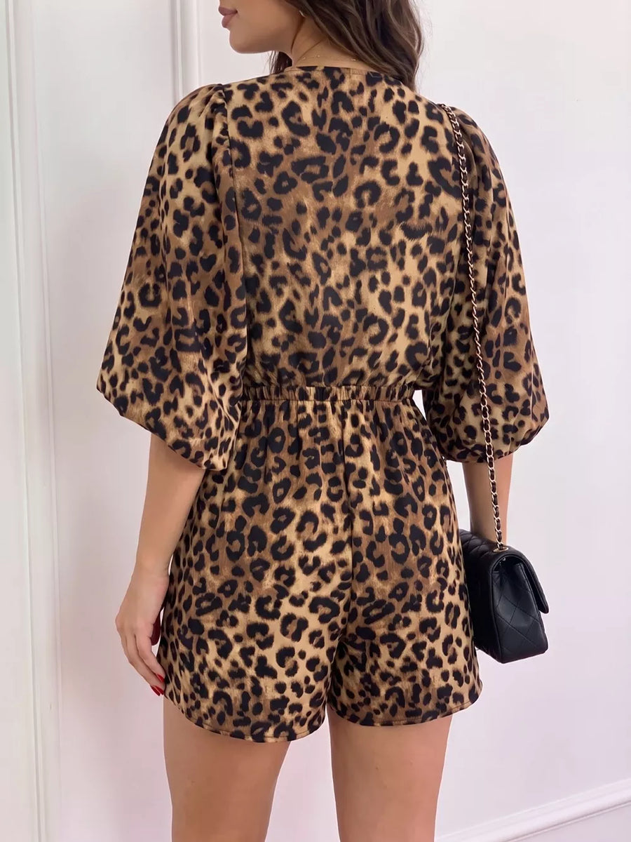 black romper featuring ruffled and leopard-print