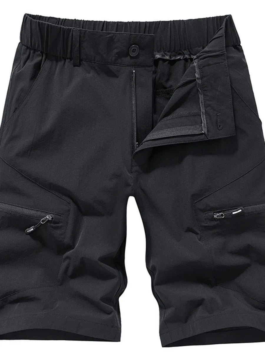 Black men's cargo shorts with elastic waistband, drawstring, zip fly, and zippered cargo pockets.
