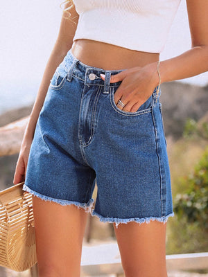 Medium wash denim shorts with frayed hem and a casual, comfortable fit.