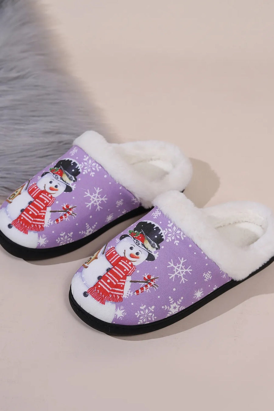 Purple snowman print faux fur lined slippers with snowflake pattern