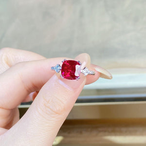 ring in ruby red with geometric and zircon stone