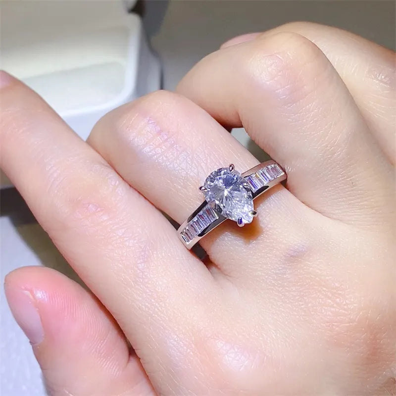 Silver pear cut moissanite and baguette ring