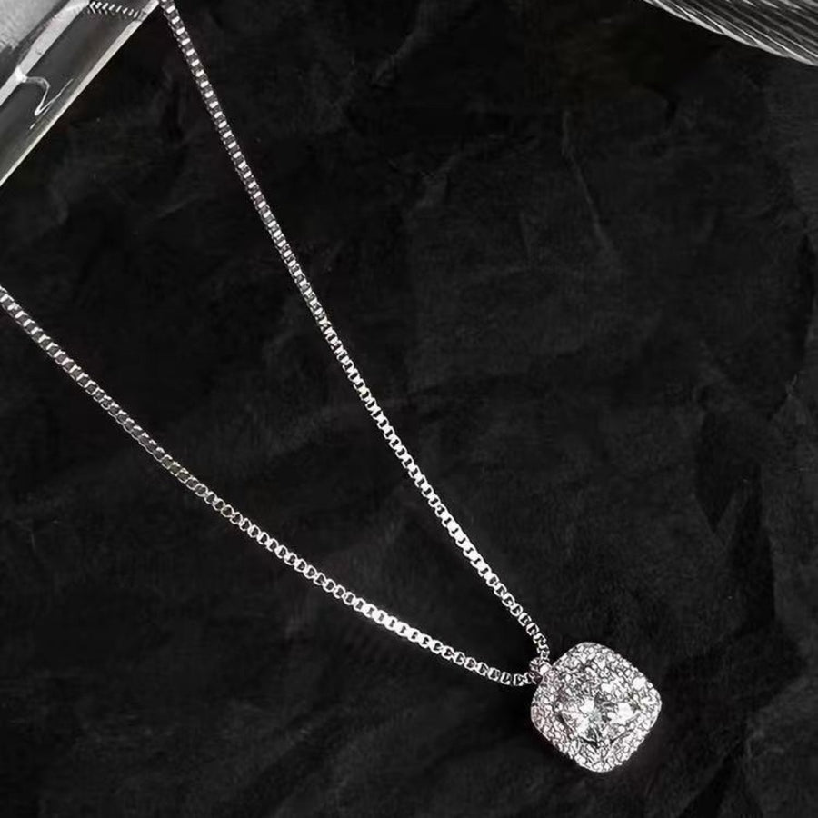 Sterling silver square pendant necklace with dazzling stones on a delicate chain.
