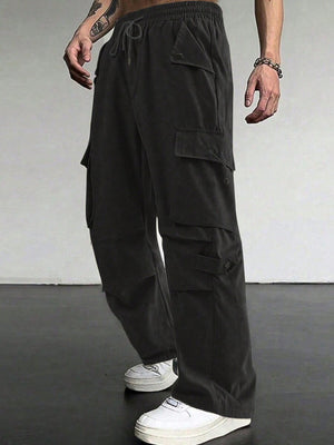 Black cargo pants with drawstring waist and multiple flap pockets.