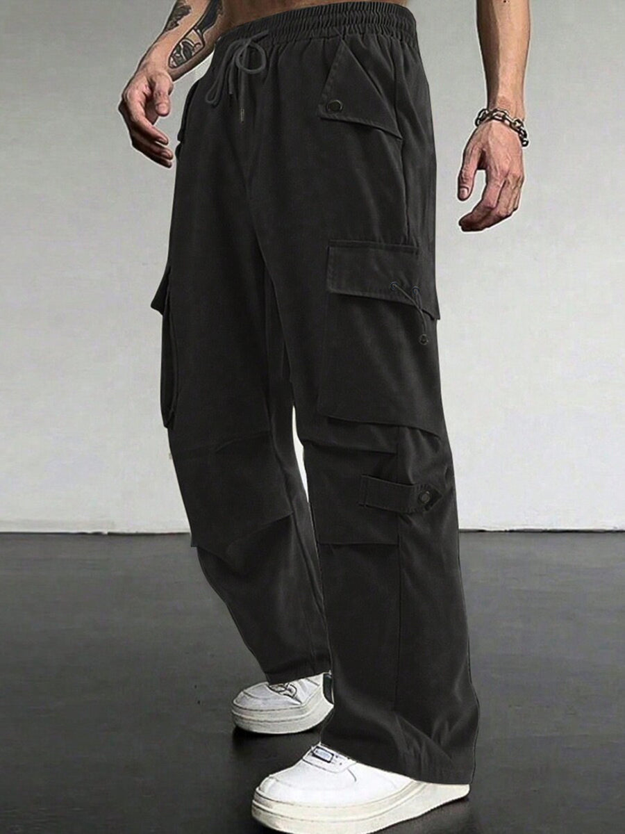 Black cargo pants with drawstring waist and multiple flap pockets.