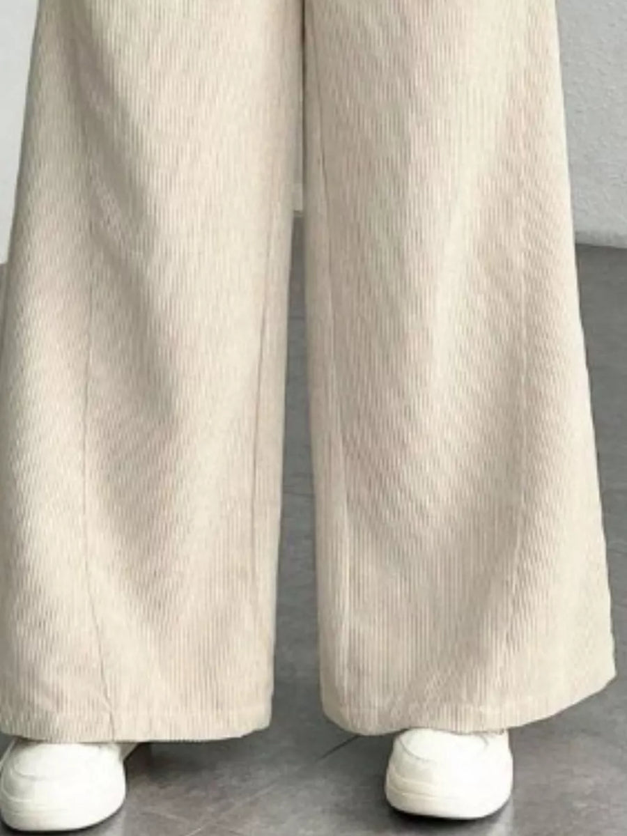 Apricot corduroy wide-leg maternity trousers with a relaxed fit.