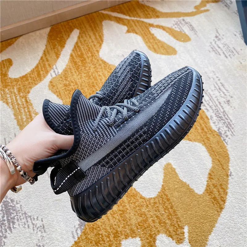 Textured knit platform sneakers in dark gray with a ribbed sole and lace-up closure.