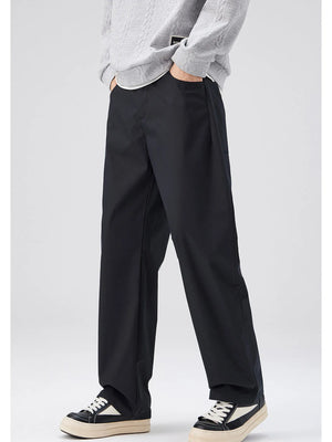 Black oversized casual pants with a loose fit and cotton blend material.