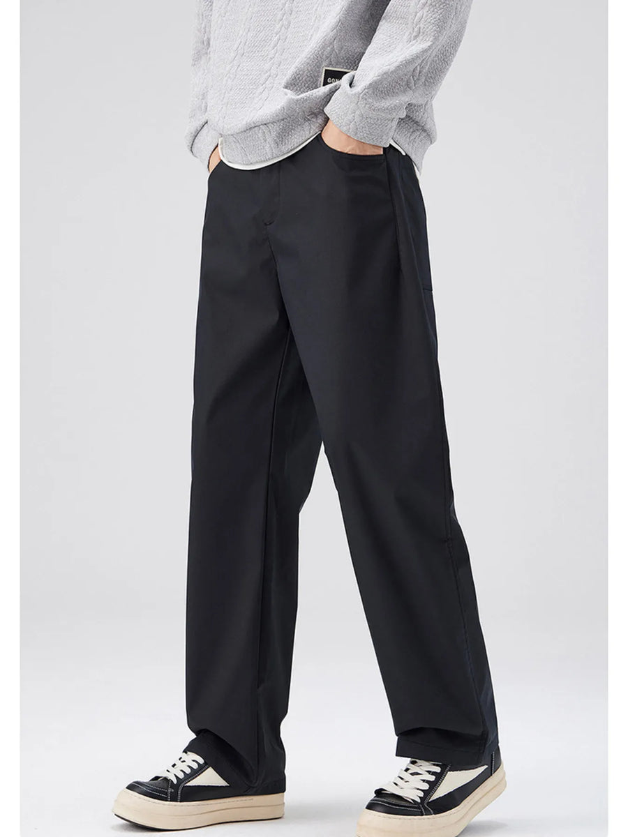 Black oversized casual pants with a loose fit and cotton blend material.