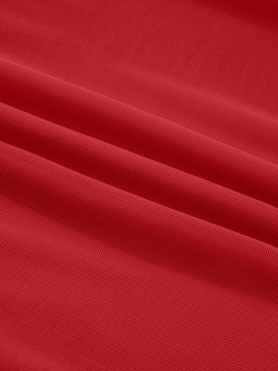 Deep red sheer mesh fabric with a honeycomb pattern, showing texture and drape.