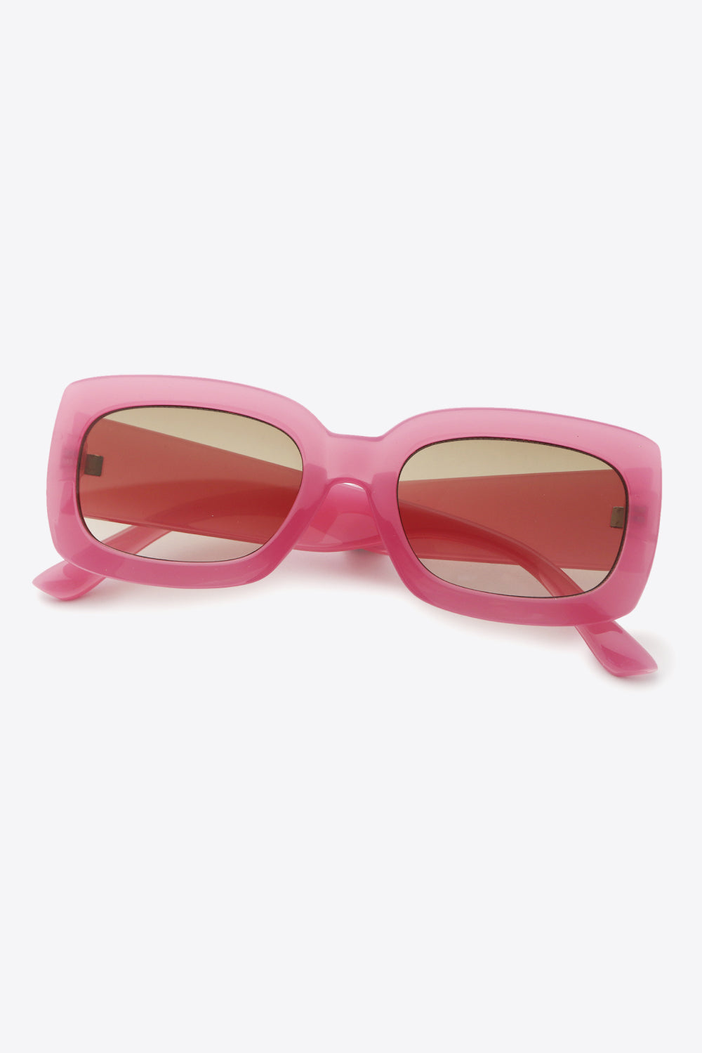 Bubblegum pink acetate rectangular sunglasses with tinted lenses