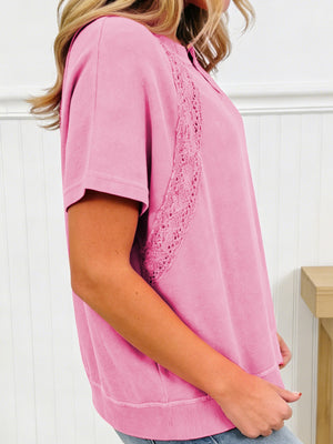 Pink mineral wash cotton tee with lace detail and notched neckline.