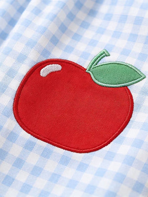 Sky blue gingham toddler dress with red apple appliqué detail.