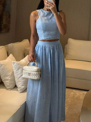 Light blue eyelet cropped top and maxi skirt set with beaded trim.