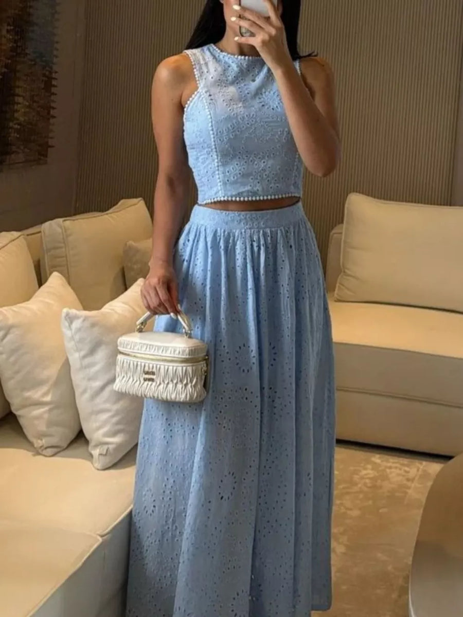 Light blue eyelet cropped top and maxi skirt set with beaded trim.