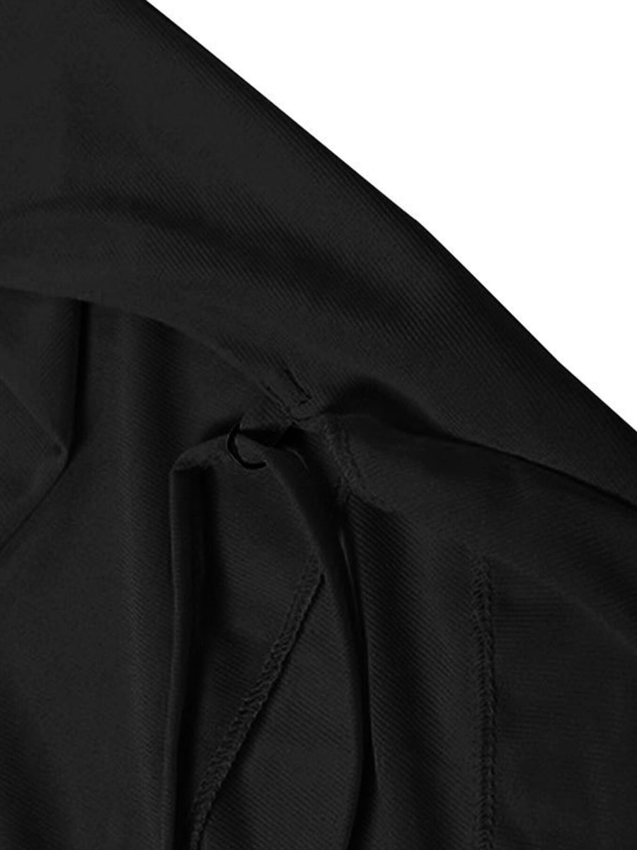 Black backless mini dress with ruffled detail and asymmetrical hem.