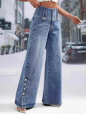 Wide-leg denim jeans with button accents and a high waist.