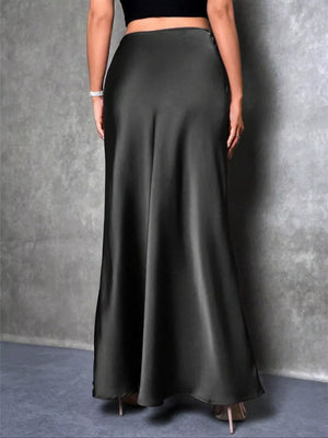 Black satin high-waisted maxi skirt with a flowing silhouette.