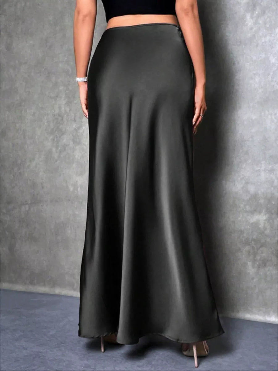 Black satin high-waisted maxi skirt with a flowing silhouette.