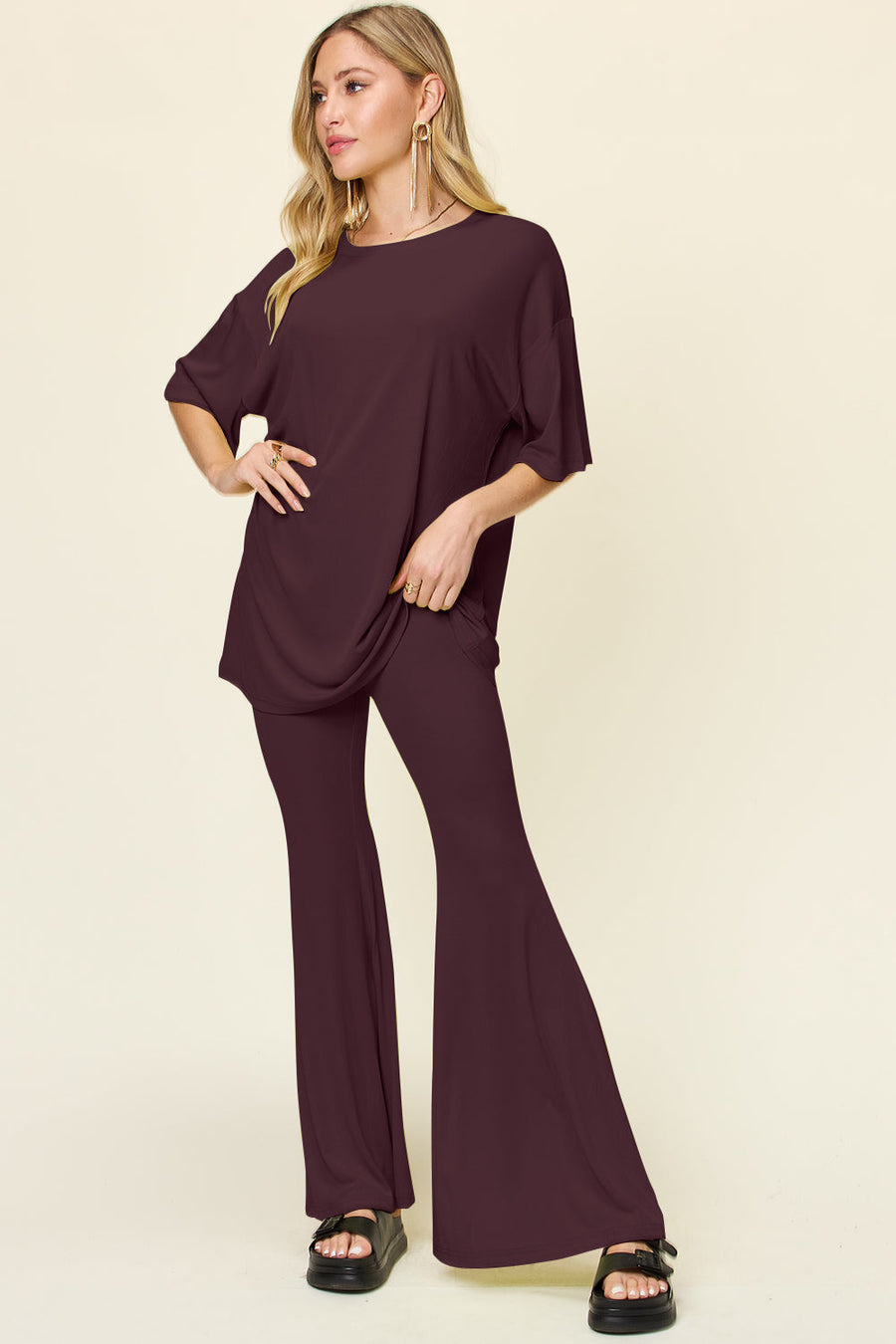 Oversized tee and flare leg pants set in deep red, with short sleeves and a round neckline.