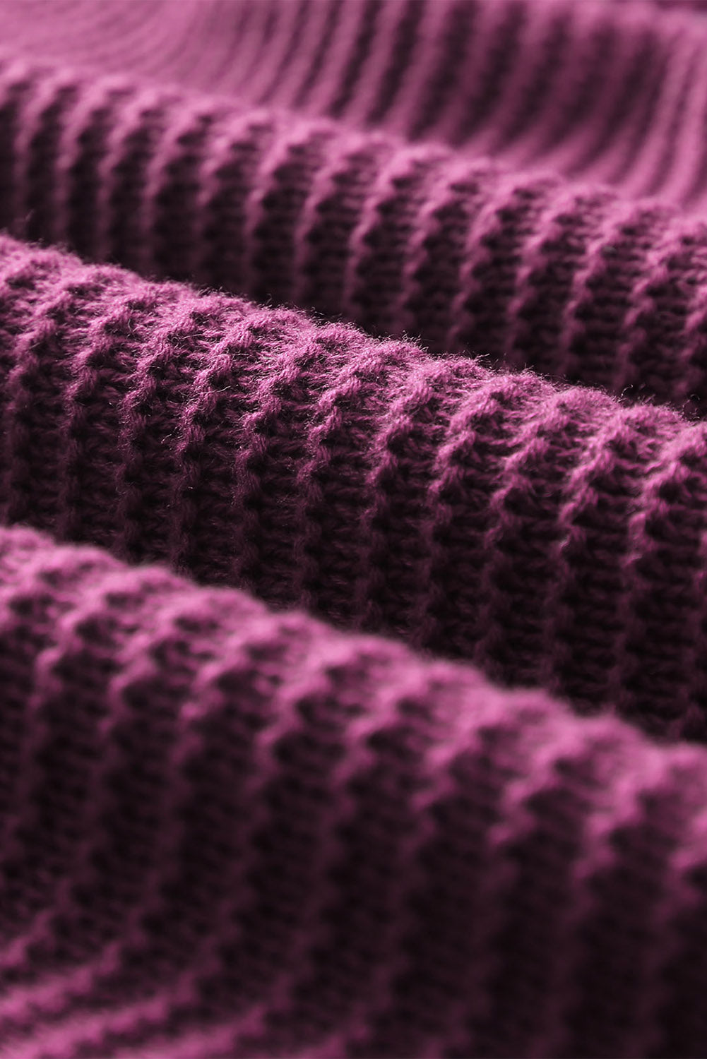 Textured knit hooded pullover in burgundy acrylic with a detailed ribbed pattern.