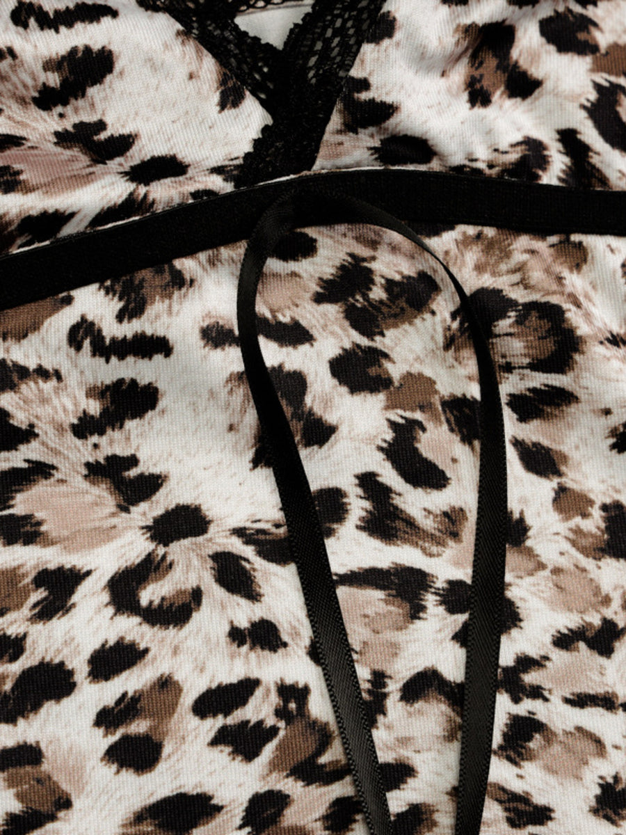 Print lace cami tank top with leopard pattern and black ribbon detail.