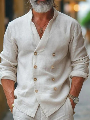 Men's white cotton double-breasted casual shirt with band collar and button details.