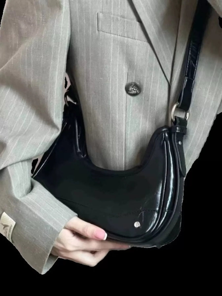 Black PU leather mini shoulder bag with a chain strap and silver hardware.