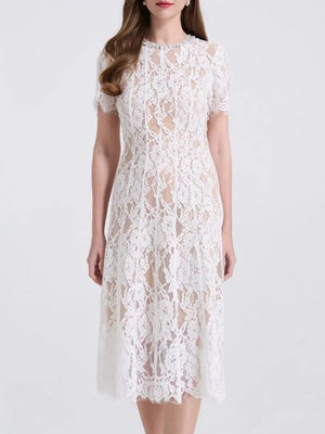 White lace midi dress with pearl embellishments and short sleeves.
