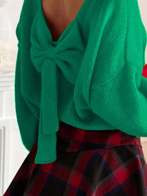 Green long-sleeve sweater with a large bow detail at the back.