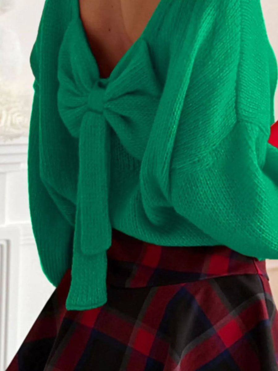 Green long-sleeve sweater with a large bow detail at the back.